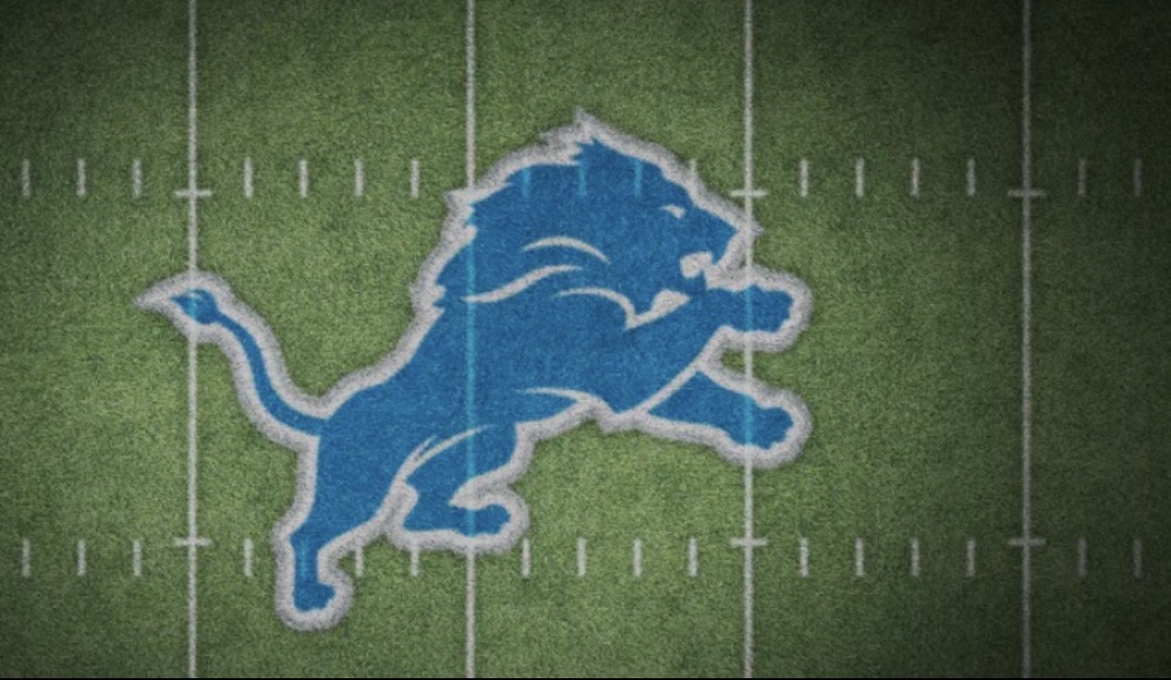 Detroit Lions banner on a football field